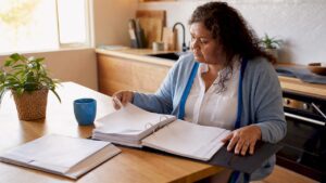 Woman reviewing estate grant legal documents